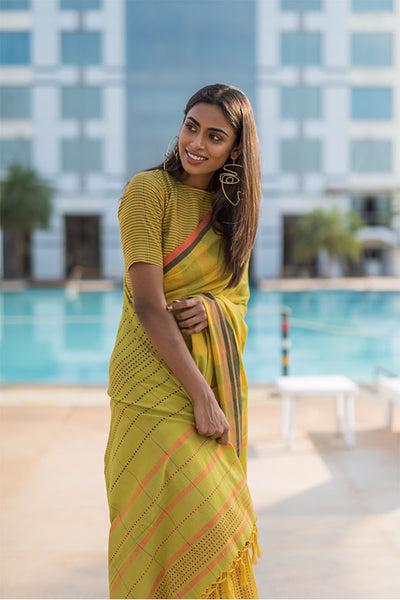 Turmeric yellow saree with chilli flakes and peppercorn dots. - noolbyhand.com